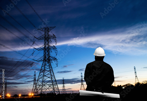 Wallpaper Mural silhouette of engineers standing at electricity station Torontodigital.ca