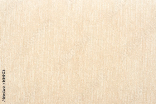 Vertical rough texture of vinyl wallpaper for abstract backgrounds of beige color