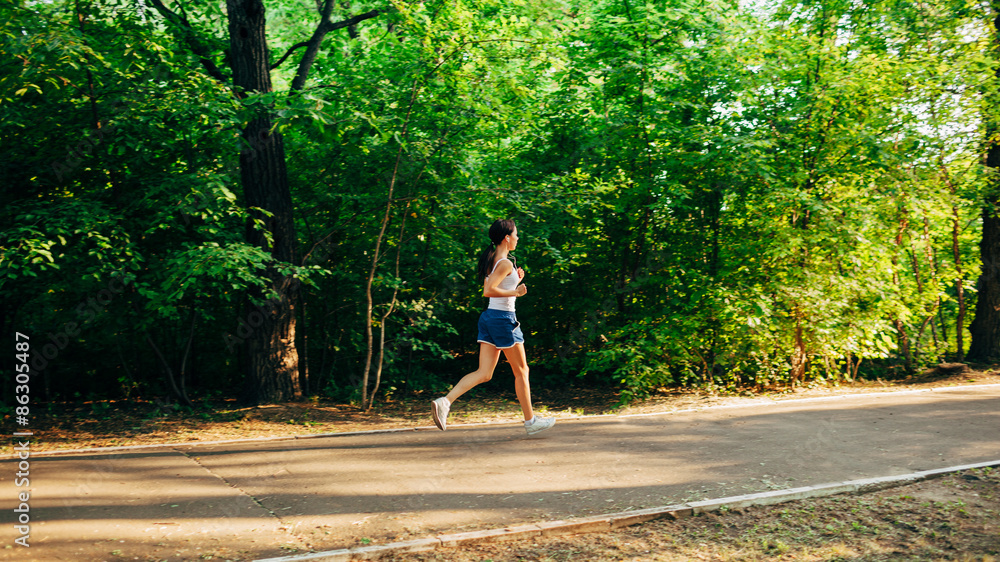 woman running in the park woman running in the park