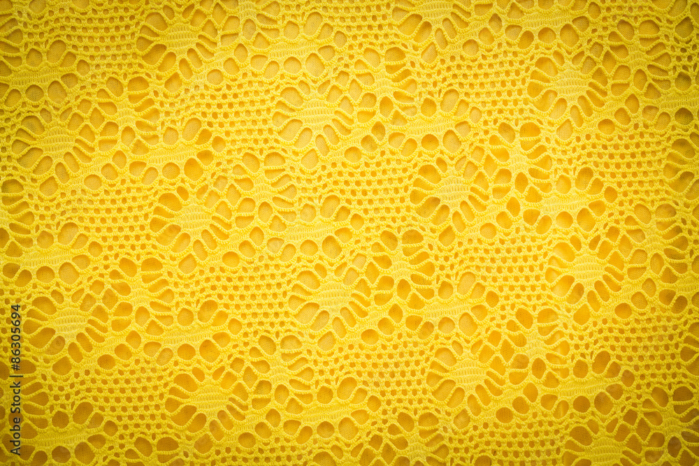 Yellow lace fabric background texture.