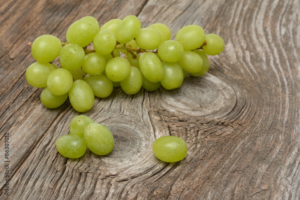 green grapes on wooden background green grapes on wooden background