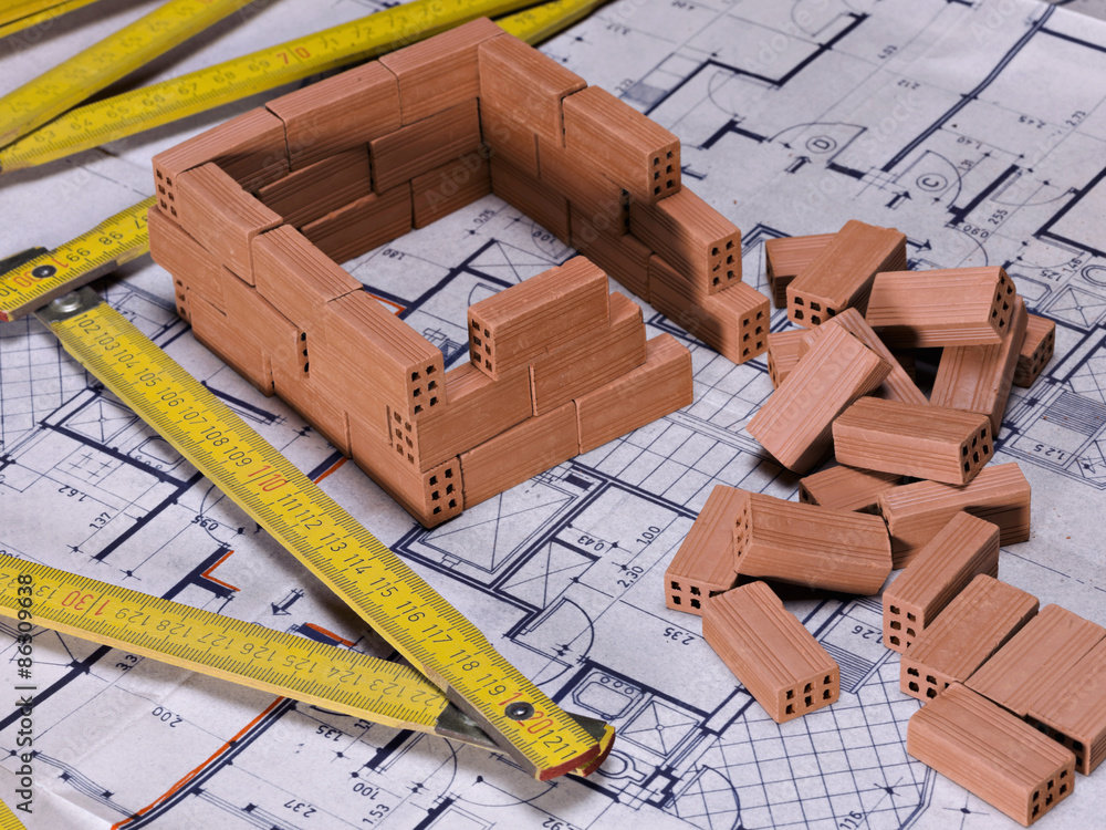 Technical plan of a house, with a bricks above Stock Photo | Adobe Stock