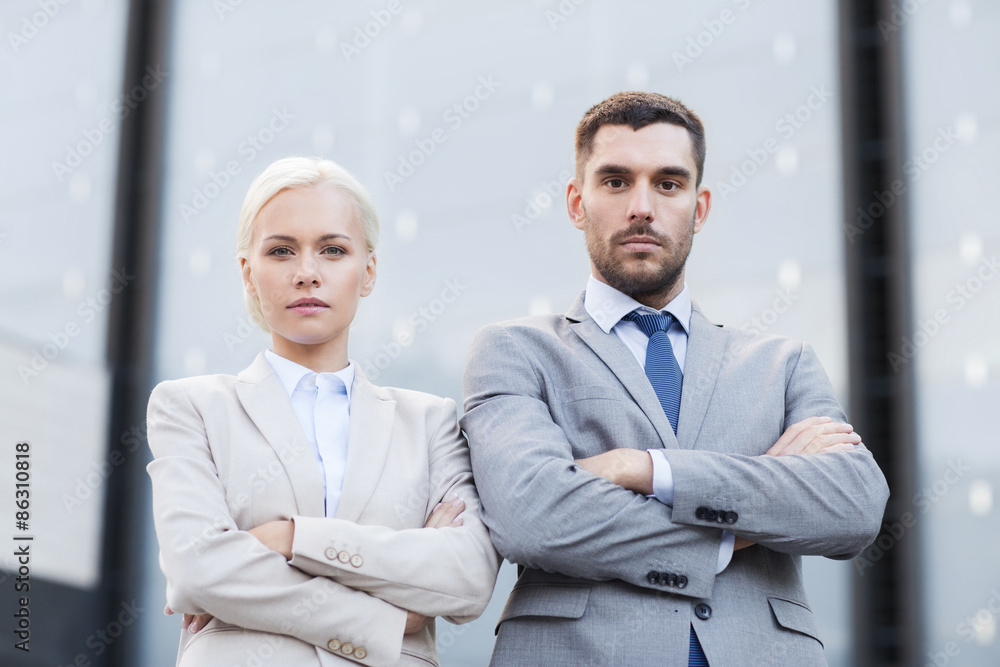 serious businessmen standing over office building serious businessmen standing over office building