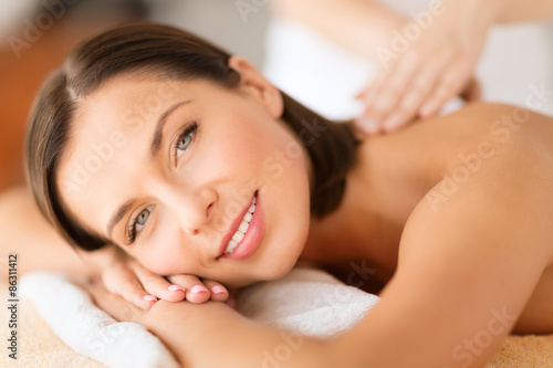 beautiful woman in spa salon getting massage