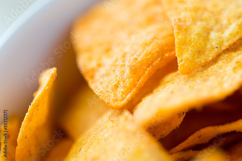 close up of corn crisps or nachos in bowl