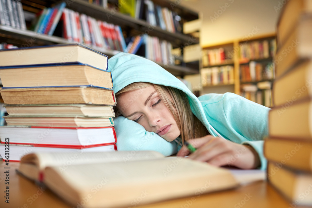 student or woman with books sleeping in library student or woman with books sleeping in library