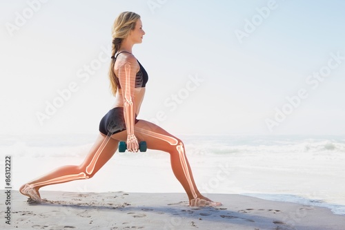 Highlighted bones of exercising woman photo