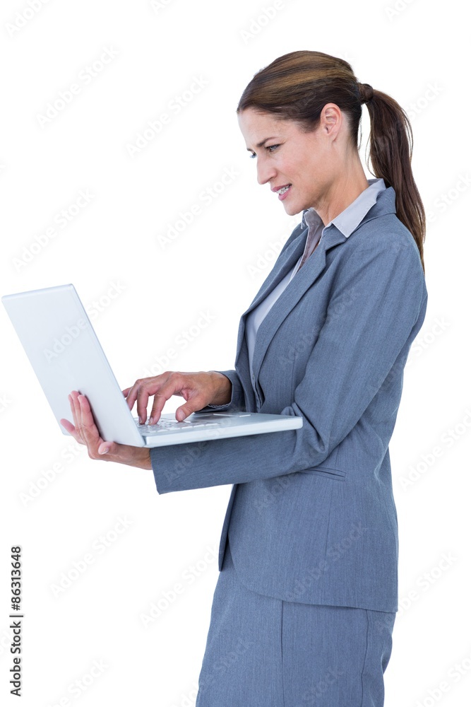 image of confident businesswoman holding laptop image of confident businesswoman holding laptop