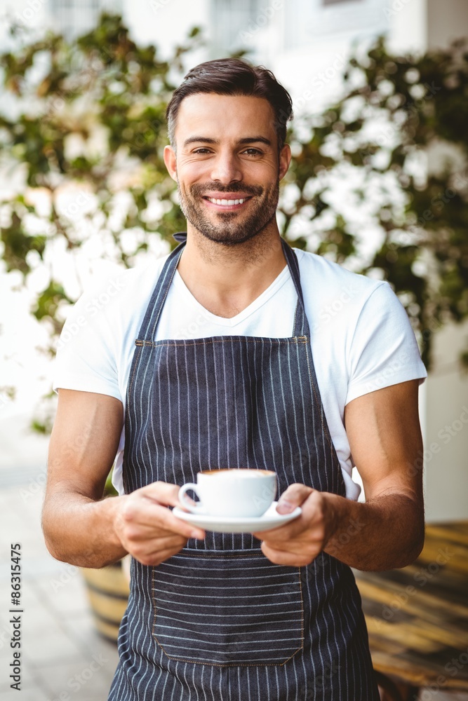 Handsome waiter smiling at camera Handsome waiter smiling at camera