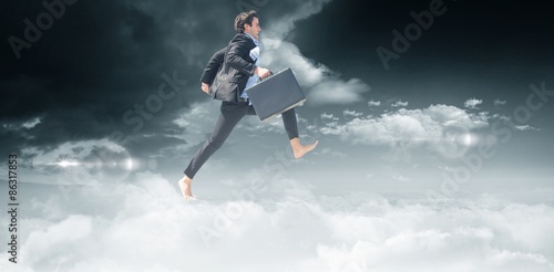 Composite image of leaping businessman