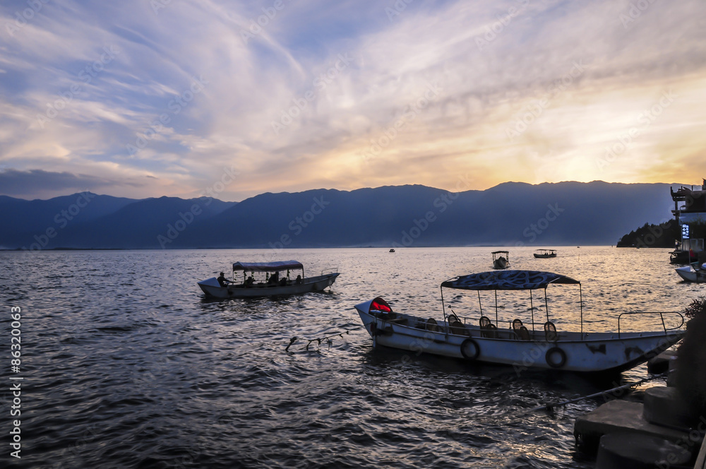 The boat in erhai lake at sunset 
