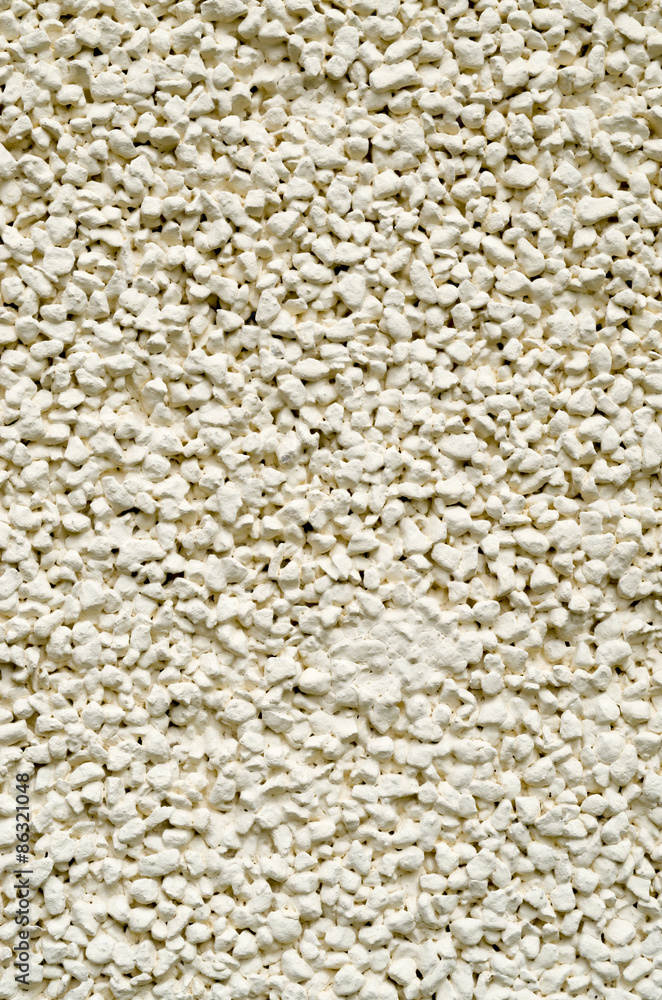 Ecru plaster from pebbles on wall closeup Ecru plaster from pebbles on wall closeup