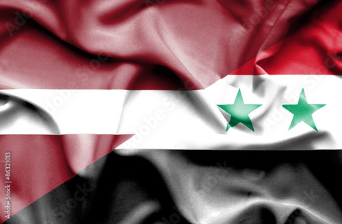 Waving flag of Syria and Latvia