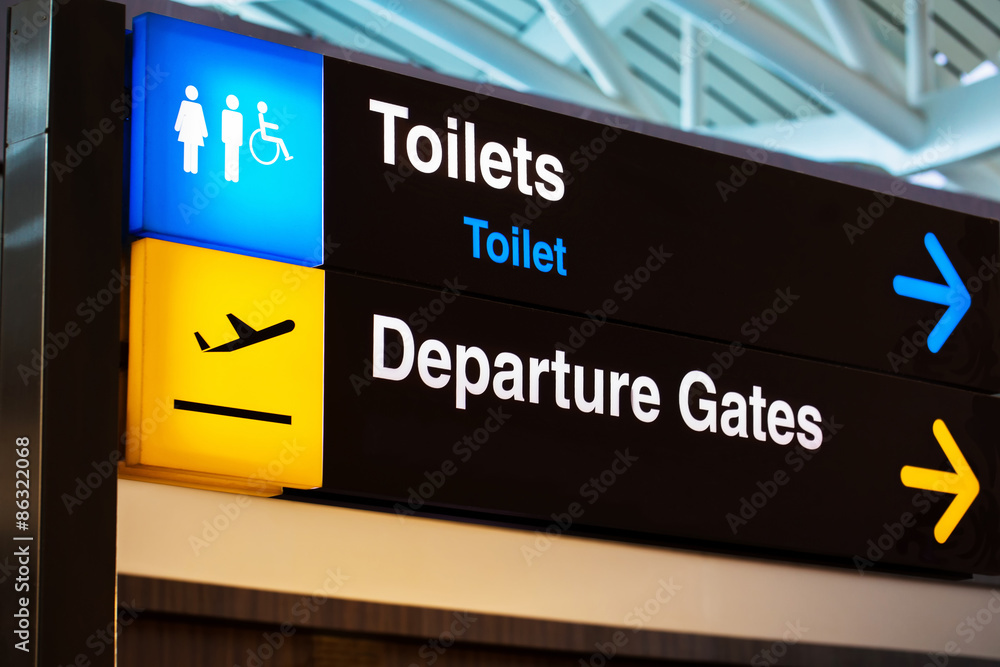 Airport sign for toilet and departure gates Airport sign for toilet and departure gates