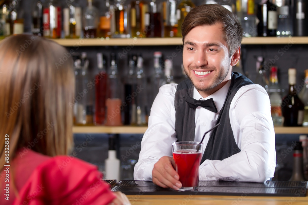 Bartender talking to visitor