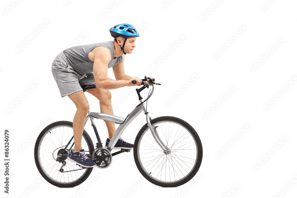 Naklejka premium Young male biker riding a gray bicycle