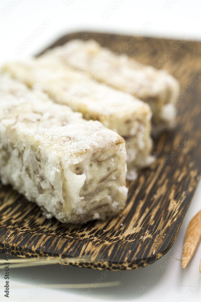 Chinese and Thai dessert of sweet taro fried on palm wood dish Chinese and Thai dessert of sweet taro fried on palm wood dish