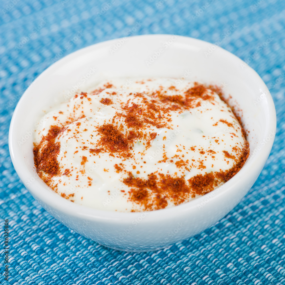 Paprika & Chive Dip - Sour cream and chive dip dusted with smoked paprika on a blue background.
Paprika & Chive Dip - Sour cream and chive dip dusted with smoked paprika on a blue background.
