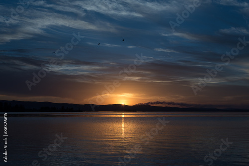 sunset at coast of the lake