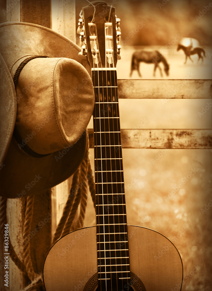Fototapeta premium Cowboy hat and guitar.American music background