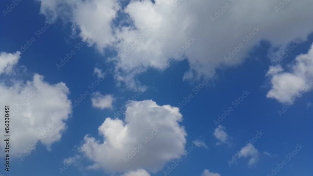Cloudscape Time Lapse. Blue sky and rolling white clouds Cloudscape Time Lapse. Blue sky and rolling white clouds