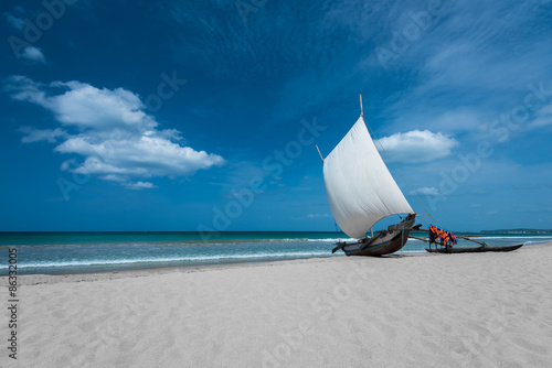 Beautiful canves boat in the beach in hot sunny day