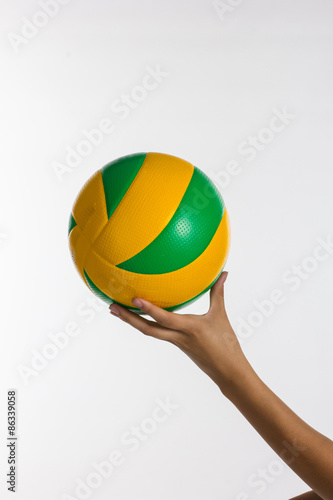 Young sport woman with volleyball ball isolated