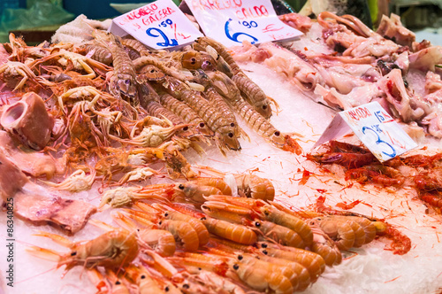 Fresh shrimps and other seafood on ice at the market