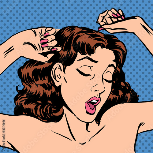 In the morning a woman wakes up in bed yawning after sleep