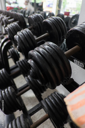 Fototapeta Naklejka Na Ścianę i Meble -  weight training in gym bodybuilding equipment
