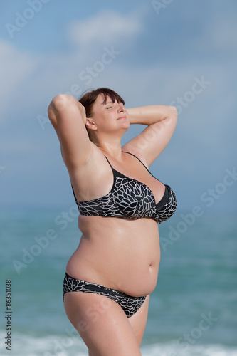 Fotografie Woman in swimwear at the sea