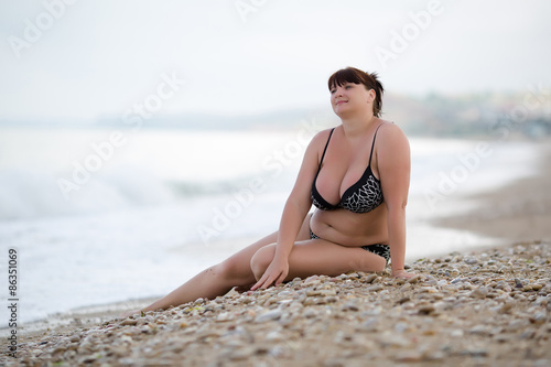 Woman in swimwear at the sea photo