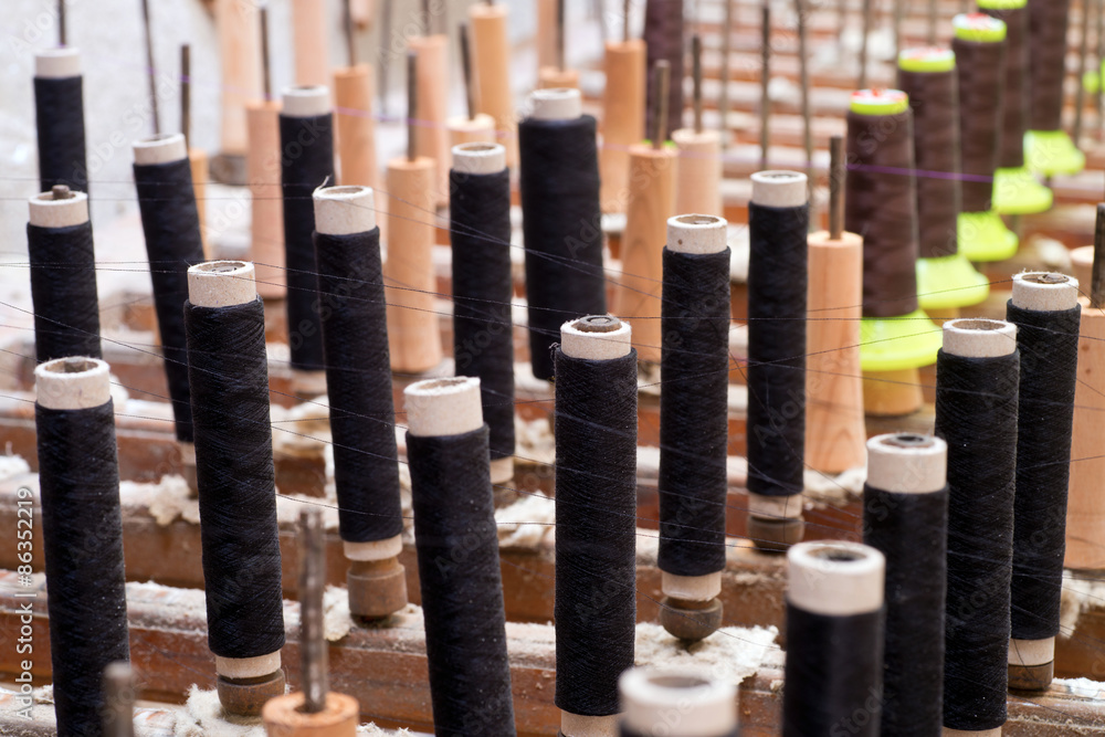 Closeup of weaving thread for the textile industry Closeup of weaving thread for the textile industry