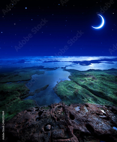 Night sky with moon and stars on the seaside