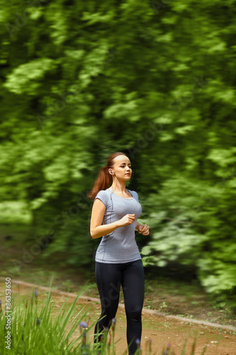 Sport fitness running woman  in the park on a sunny day