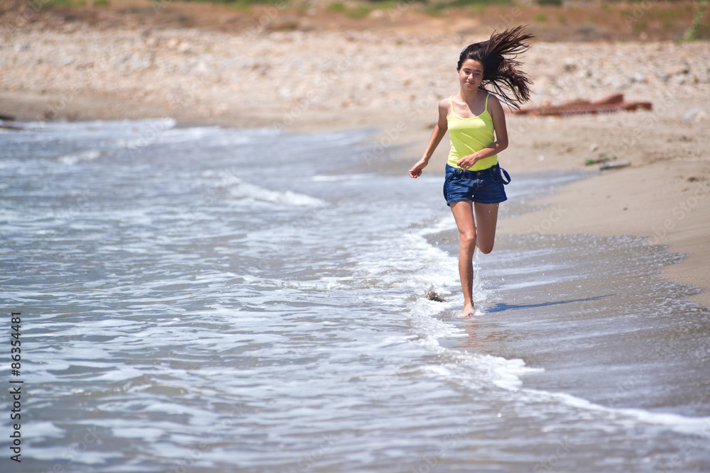 young girl running on the beach young girl running on the beach