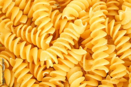 Full background of dry uncooked rotini pasta photo