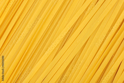 Full background of dried uncooked linguine pasta
