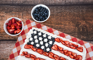 Patriotic American flag cake with blueberries and strawberries
