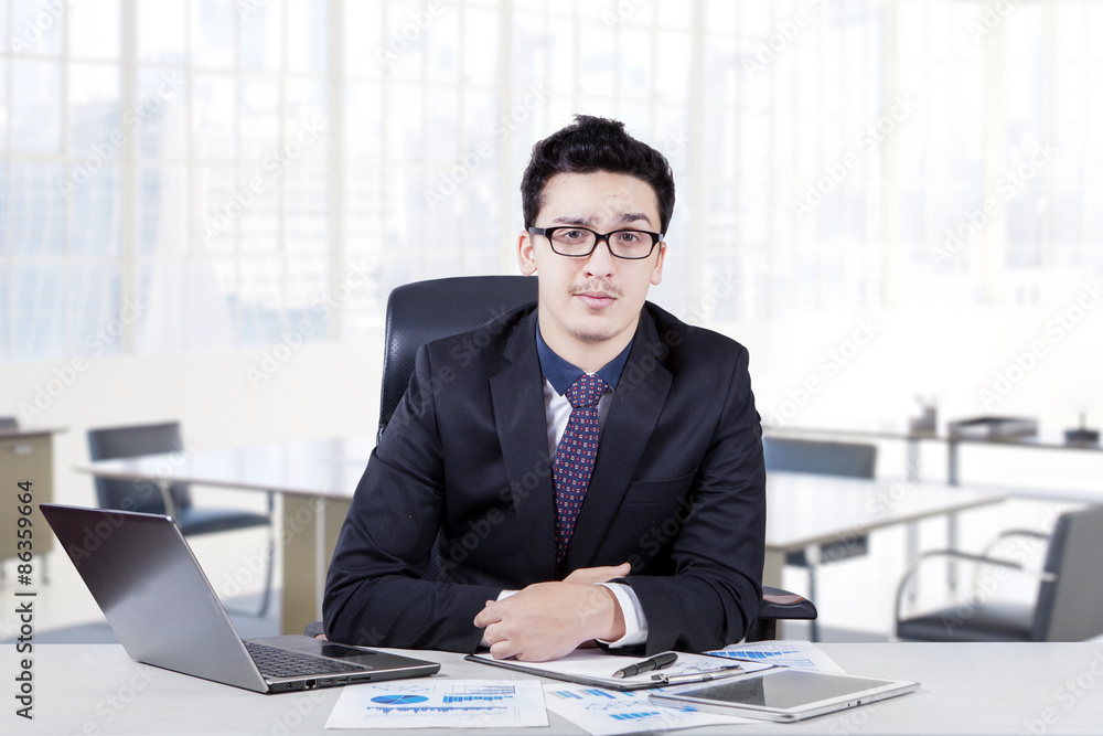 Handsome manager sitting in the office Handsome manager sitting in the office