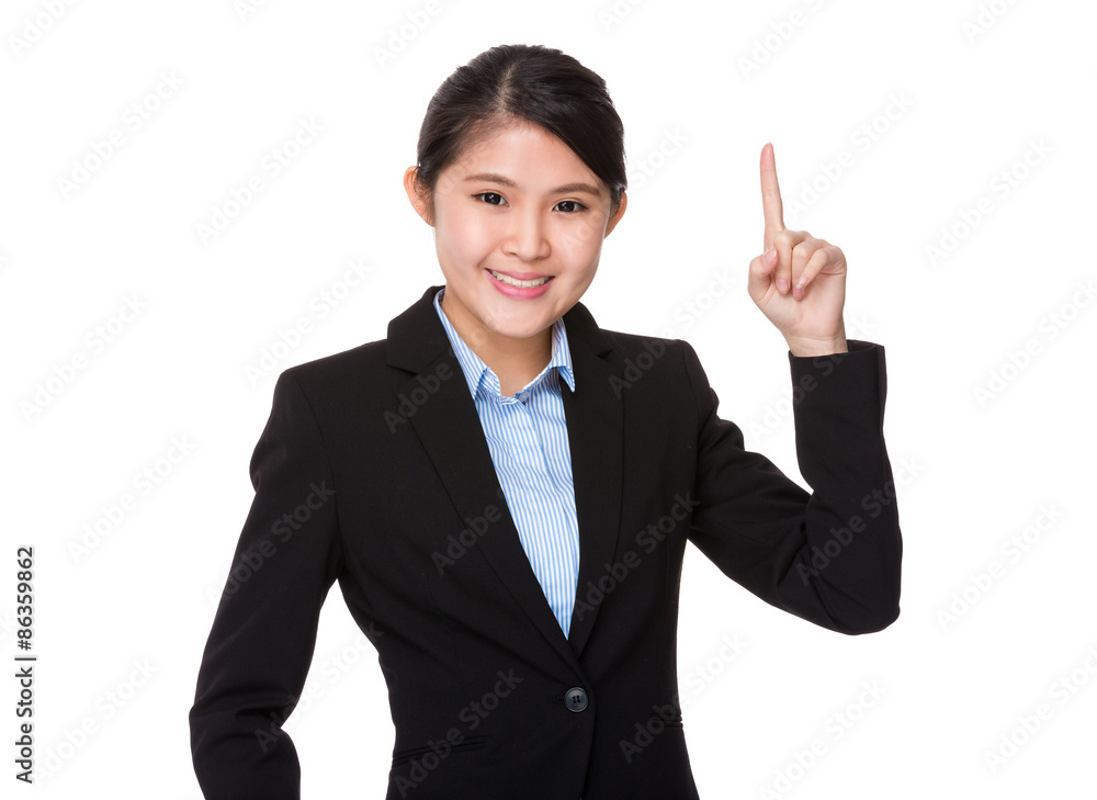Young businesswoman showing pointer up Young businesswoman showing pointer up