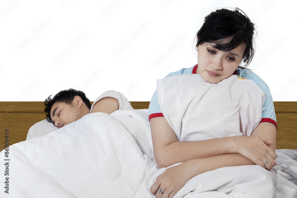 Fototapeta premium Sad woman sitting near her husband