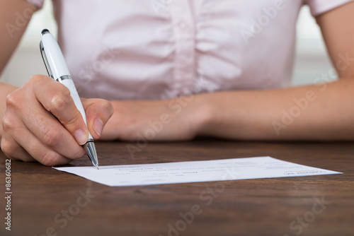 Person Hands Signing Cheque