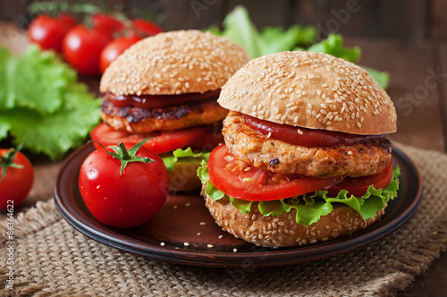 Sandwich with chicken burger, tomatoes and lettuce