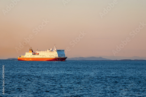 Ferry on the sea at sunset