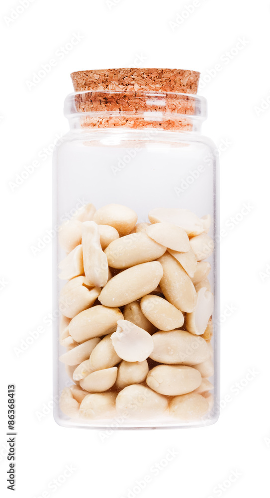 Peeled salted peanut in a glass bottle with cork stopper, isolat Peeled salted peanut in a glass bottle with cork stopper, isolat