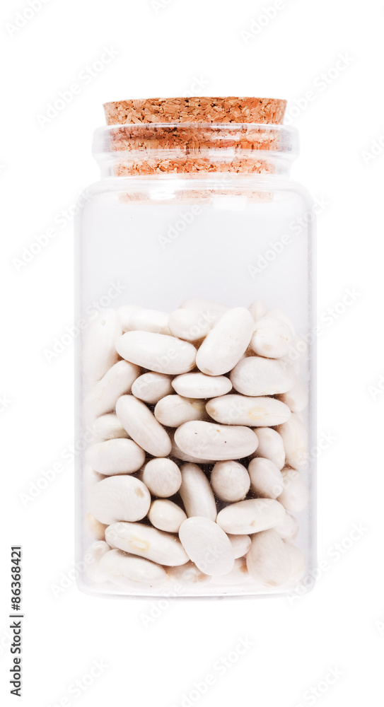 White kidney bean in a glass bottle with cork stopper, isolated White kidney bean in a glass bottle with cork stopper, isolated
