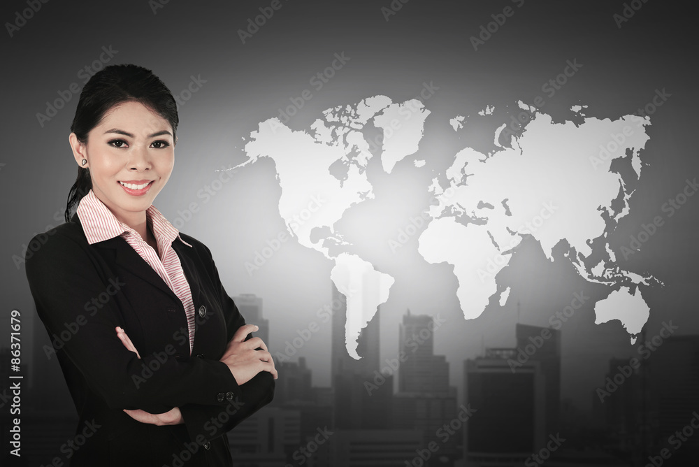 Business woman standing in front of world map Business woman standing in front of world map
