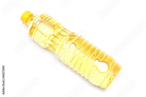 Bottle of vegetable oil for cooking isolated on white background .