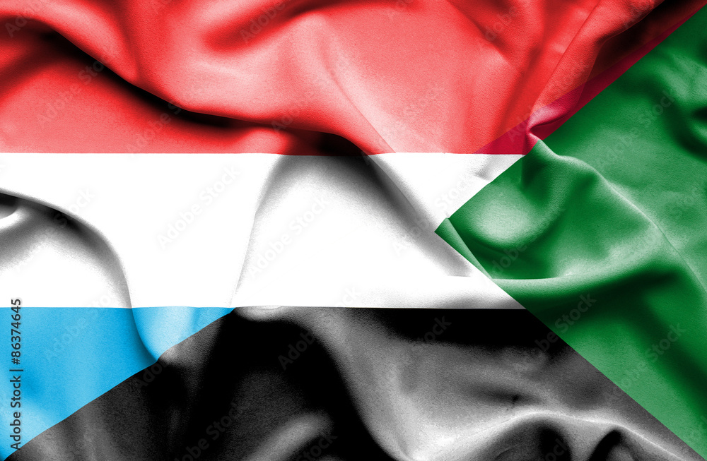 Waving flag of Sudan and Luxembourg